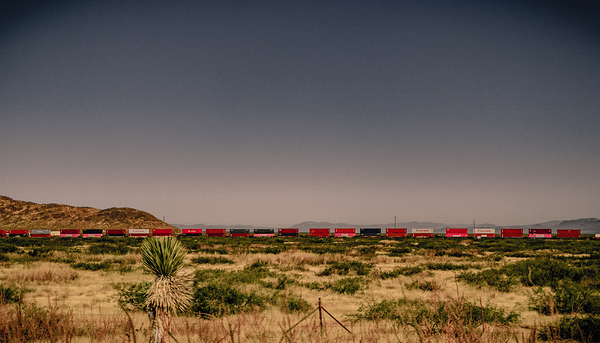 3 Miles of Red Boxcars Somewhere in Space Print